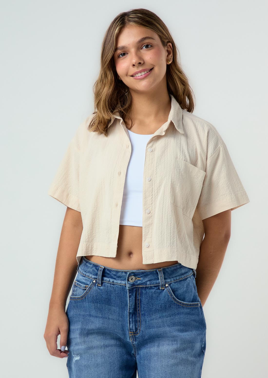 Blusa arena con bolsillos para adolescentes